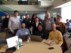 Wilmington Assistant Town Manager Kendra Amaral (standing center) and her winning team at Code Across Boston. (Photo from @CodeForBoston on Twitter)