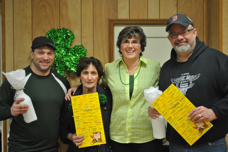 Sponsor Peter MacLellan (far left) and Chef Lou Cimaglia (far right), with Elderly Services Director Terri Marciello