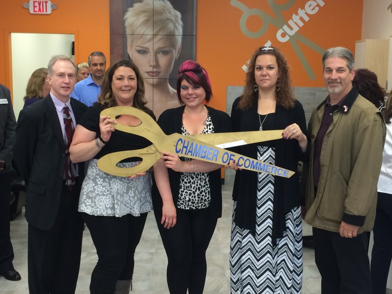 Wilmington Town Manager Jeff Hull and Selectman Michael Champoux help cut the ribbon and official open the new Hair Cuttery salon on Ballardvale Street From L to R: Town Manager Jeff Hull, Stylist Denise Tartarini, Salon Leader Erika Richards, Stylist Laura Williams, Selectman Michael Champoux