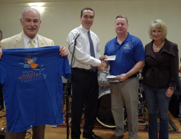 The NEMLEC Police Foundation donated $5,000 to Where Angels Play Foundation, which built a playground in memory of former MIT Police Officer Sean Collier. Left-to-right: Belmont Police Chief Richard McLaughlin; Pepperell Police Chief David Scott; Where Angels Play Founder William Lavin; NEMLEC Foundation Coordinator Sharon Crowley.