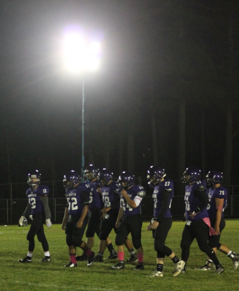 Shawsheen football players get ready for a play during Saturday night’s game under the lights at Shawsheen’s Cassidy Field. 