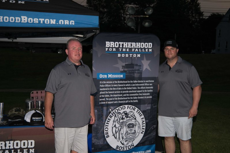 Travel Coordinator Douglas McGrath and Pres Patrick Munroe on the right